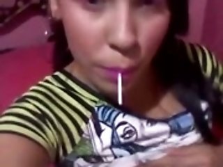 Kinky teen gal sucking lollipop while playing with her punani